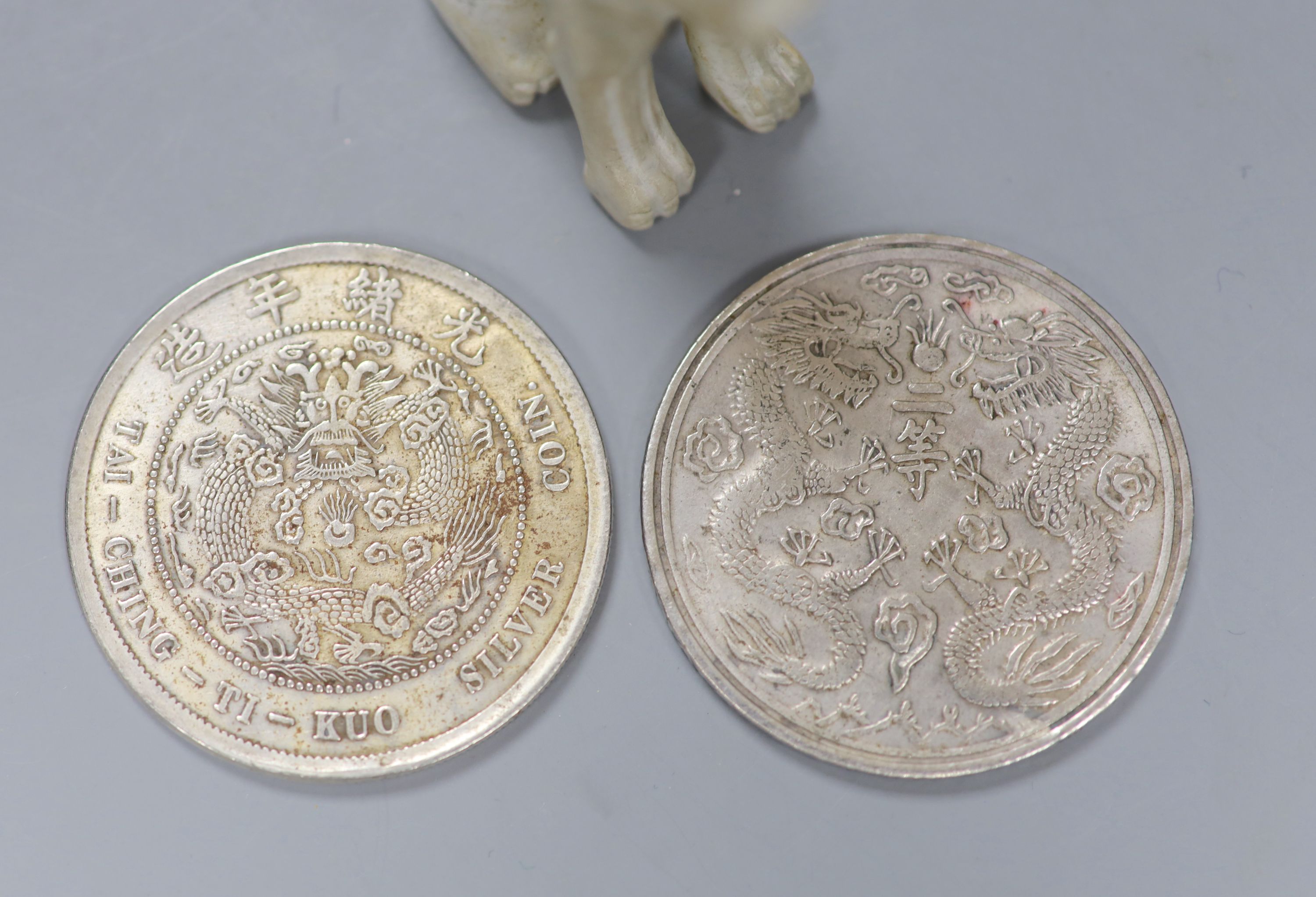 Two reproduction Chinese coins and a hardstone carving